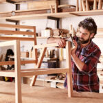 Serious,Furniture,Designer,Carefully,Sanding,A,Chair,Frame,That,He