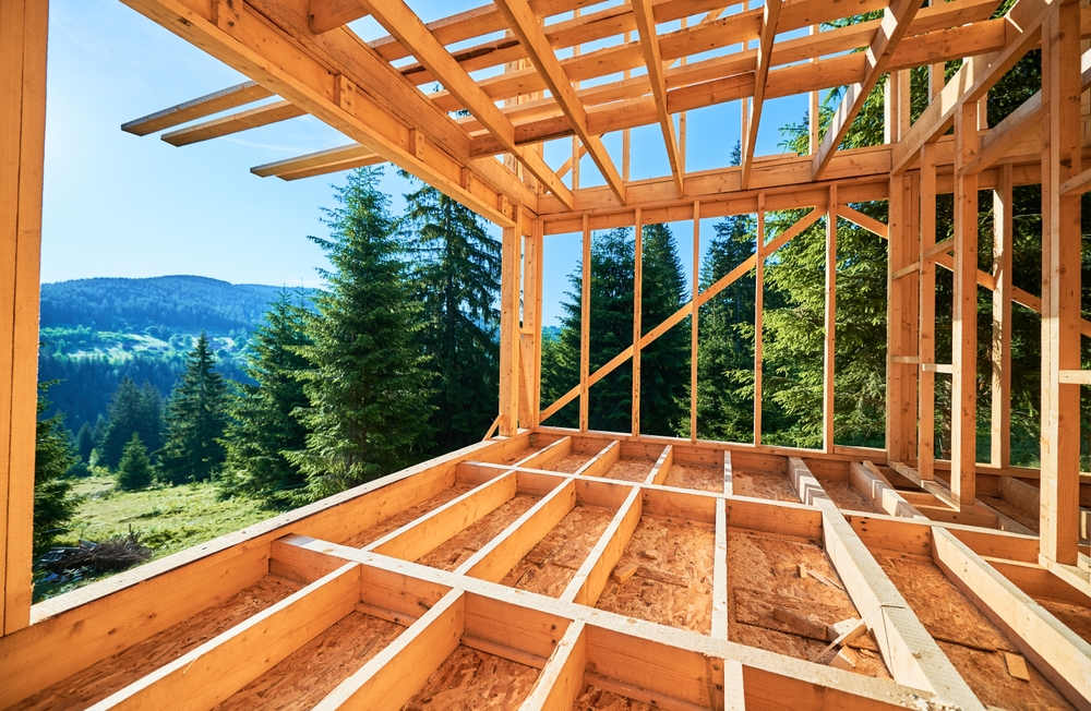 Wooden,Frame,House,Under,Construction,Near,Forest.,Beginning,Of,New