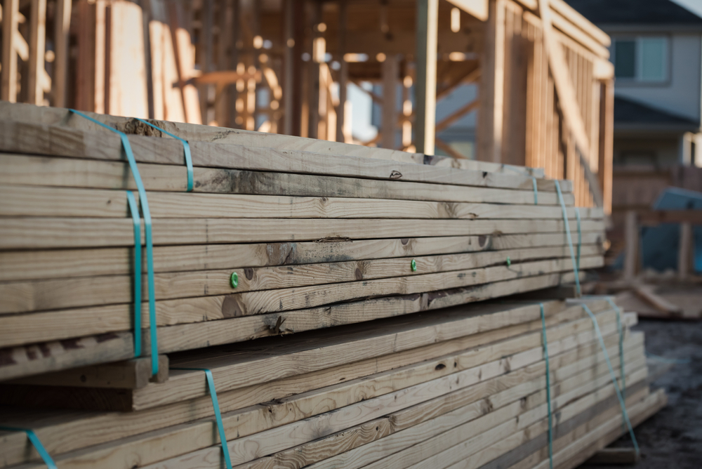 A,Pile,Of,Lumber,At,A,New,Home,Construction,Site.