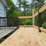 New,Boards,And,Railings,Being,Installed,On,A,Small,Deck
