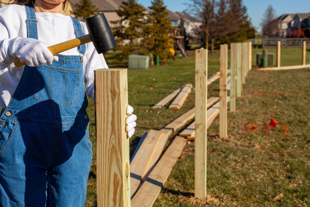 A,Woman,Diy,Enthusiast,Wearing,Overalls,And,Safety,Gloves,Is
